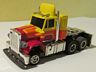 AFX slotless Speed Steer Peterbilt in yellow with red and orange