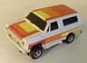 AFX magna traction Chevy Blazer in white with orange, yellow, and red