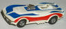 AFX slot car Corvette funny car, white with red and blue stripes.
